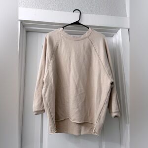 Arie size XS. Oversized tan sweater.